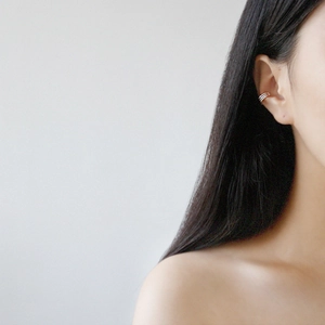 Minimalist S925 sterling silver triple layer gold ear cuff shown on a model