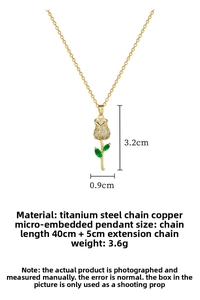 Detailed view of gold titanium necklace showing rose pendant size 3.2cm by 0.9cm