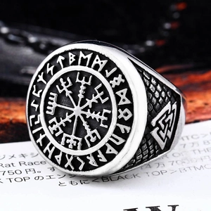 Detailed relief of Viking Vegvisir compass and Valknut symbols on vintage steel ring