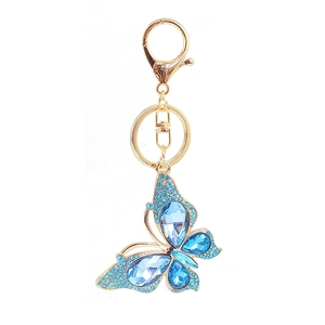Exquisite gold-plated butterfly keychain with sparkling blue crystals on white background