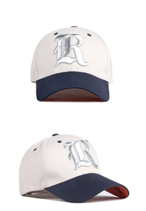 Detail of embroidered gothic R letter on cotton baseball cap with contrast brim