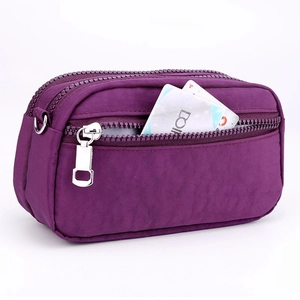 Multifunctional deep purple nylon handbag with triple zipper compartments and silver rings