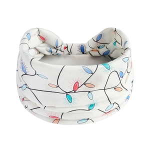 Detail of Christmas lights pattern on white elastic headband for women's holiday yoga wear
