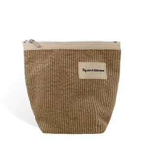 Brown corduroy cosmetic bag with a zipper and Big Star & Little Moon label on front