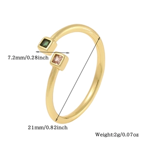 Detail shot of golden open ring with green and pink square stones including dimensions