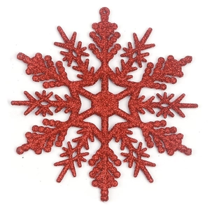 Macro shot of 10cm red snowflake ornament with sparkling glitter for Christmas tree decor