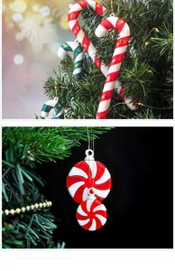 Macro shot of red and white candy cane hanging ornaments with gold strings for Xmas trees
