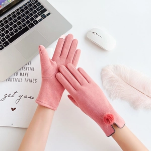 Detailed view of pink winter gloves with touchscreen finger tip and soft faux fur cuff trim
