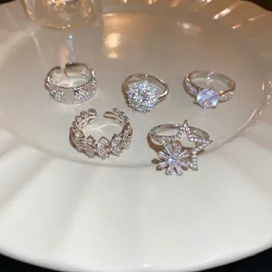 Elegant 5-piece silver snowflake zircon stackable ring set with star and floral designs