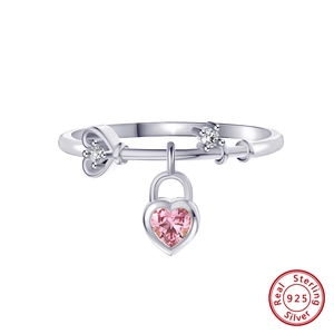 Detail of 925 sterling silver ring with pink heart charm and crystal accents