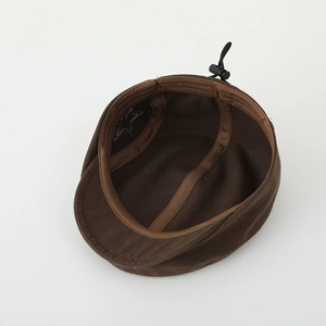 Detail view of adjustable inner strap and star stitching on brown kids beret hat