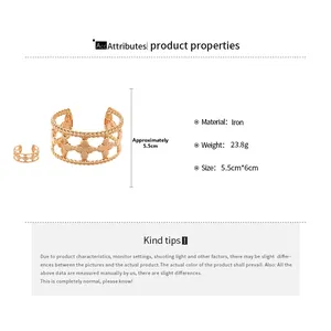Detail of rose gold clover open cuff bracelet and matching ring with hollow pattern