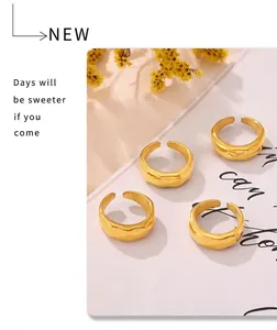 Set of four 18k gold plated adjustable open rings with irregular lava texture
