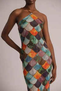 Close-up of halter dress showing colorful mermaid scale pattern and gold bead embroidery