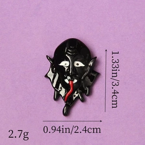 Macro shot of black ghost resin accessory with red tongue and size dimensions