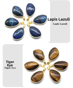 Detail showing Lapis Lazuli and Tiger Eye teardrop pendants with gold metal edging