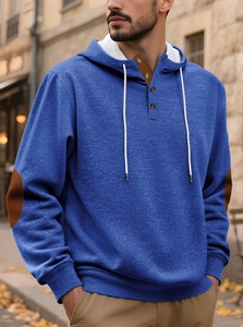 Detail of navy pullover hoodie featuring three-button placket and elbow patches