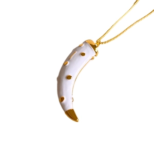 Italian Cornicello pendant necklace with white enamel and gold accents on a chain