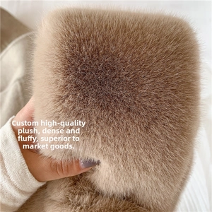Close-up of thick faux rabbit fur scarf showing dense texture and high elasticity