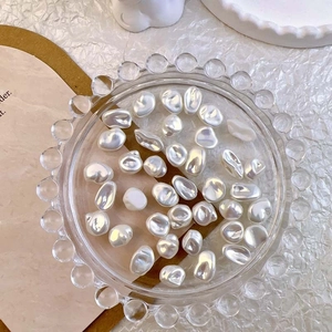 Baroque irregular pearls for nail art displayed in a decorative glass tray