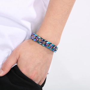 Rainbow plated titanium steel Cuban link bracelet worn on a male wrist detail view