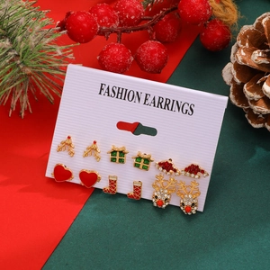 Detail of Christmas stud earring set featuring reindeer, snowflakes and gift boxes