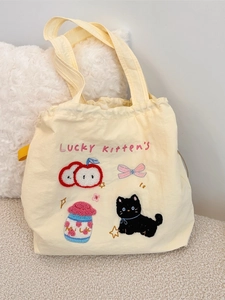 Cute pale yellow canvas tote bag with Lucky Kitten embroidery and drawstring closure