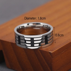 Men's vintage stainless steel ring with black enamel trigram pattern on wood base
