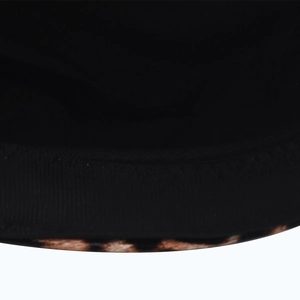 Close-up of the detailed stitching and leopard print texture on the stylish PU military hat