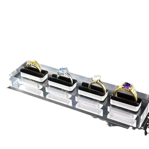 Acrylic ring display stand with 4 slots and black velvet lining on white base