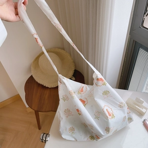 Detail of French floral cotton tote bag with pink bows and green flower print