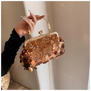 Macro detail of luxury evening bag with gold sequins, metal frame, and floral clasp handle