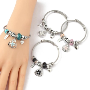 Detail of adjustable stainless steel charm bracelets with crystal beads and heart pendants
