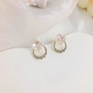 Elegant S925 silver flower stud earrings with iridescent petals and sparkling crystal ring