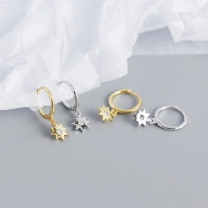 Detailed view of S925 silver and gold octagon star earrings with cubic zirconia stones