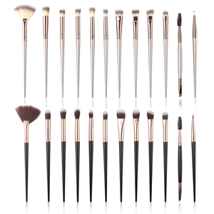 24-piece makeup brush set with champagne gold and black handles in various brush types