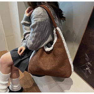 Brown faux suede tote bag featuring white faux shearling trim on shoulder strap detail