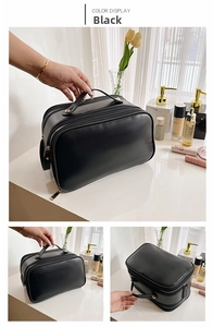 Detail of black double-layer PU leather makeup bag with gold studs and top handle