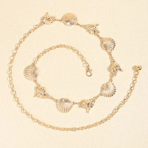 Sexy golden body chain featuring starfish and seashell pendants for beach jewelry