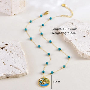 Détails du collier doré de 40,5+5cm avec pendentif palmier et dimensions précises