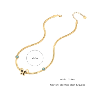 Detail of gold butterfly necklace with turquoise pendant, stainless steel material, 45cm long