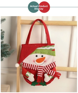 Detailed view of a 3D snowman Christmas candy bag hanging on a wooden rack