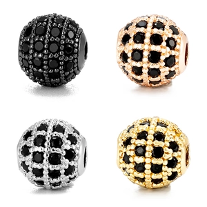 Macro shot of 8mm pave zircon sphere beads in black, rose gold, silver and gold finishes