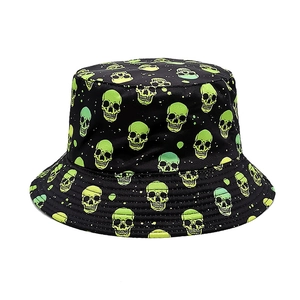 Detail of a black bucket hat featuring vibrant green skull patterns and fabric texture