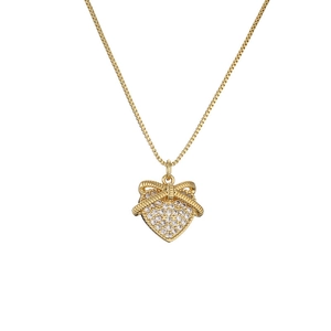 Golden heart pendant necklace with micro-p镶 zircon bow knot on white background
