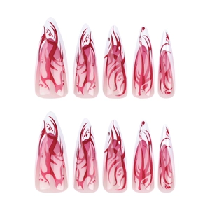 Long stiletto press-on nails with red flame gradient and tribal pattern design