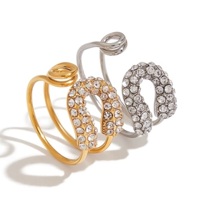 Macro detail of paperclip ring with 18K gold plating and shimmering zircon stones