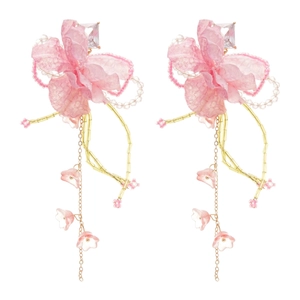 Elegant pink fabric flower earrings with crystal tassels and gold chains on white backdrop