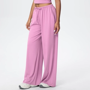 Detail of high waisted pink wide leg lounge pants with adjustable drawstring and side pockets