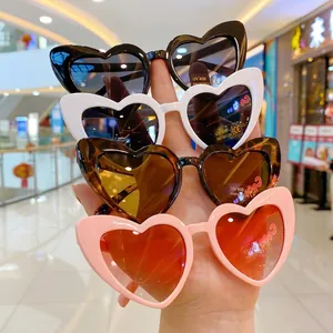 Kids heart-shaped sunglasses in black white tortoiseshell and pink with UV400 protection